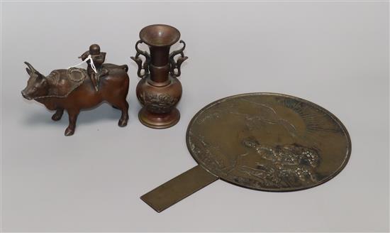 A Chinese mirror, two-handled bronze vase and metal figural buffalo